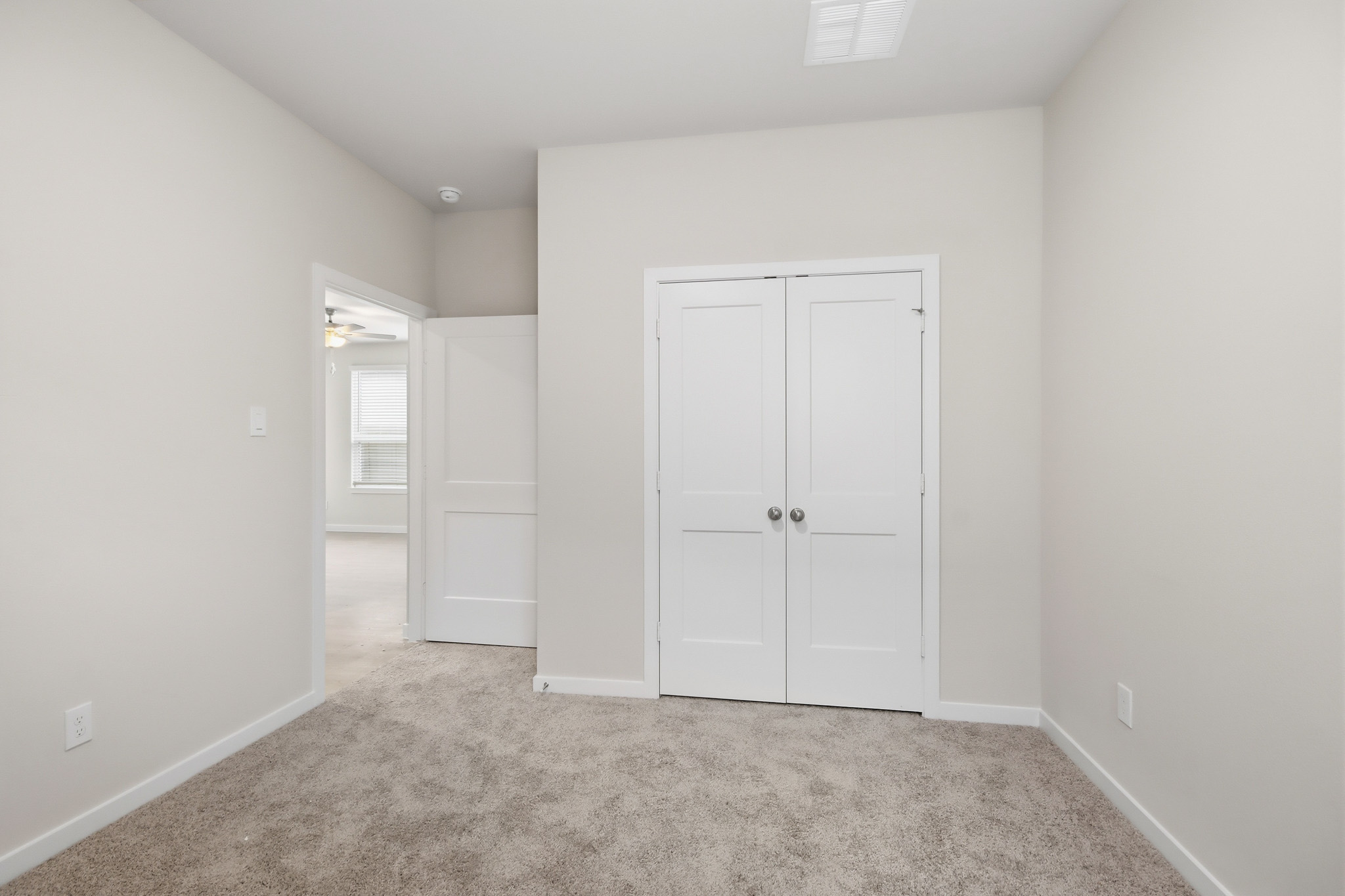 A room with white doors.