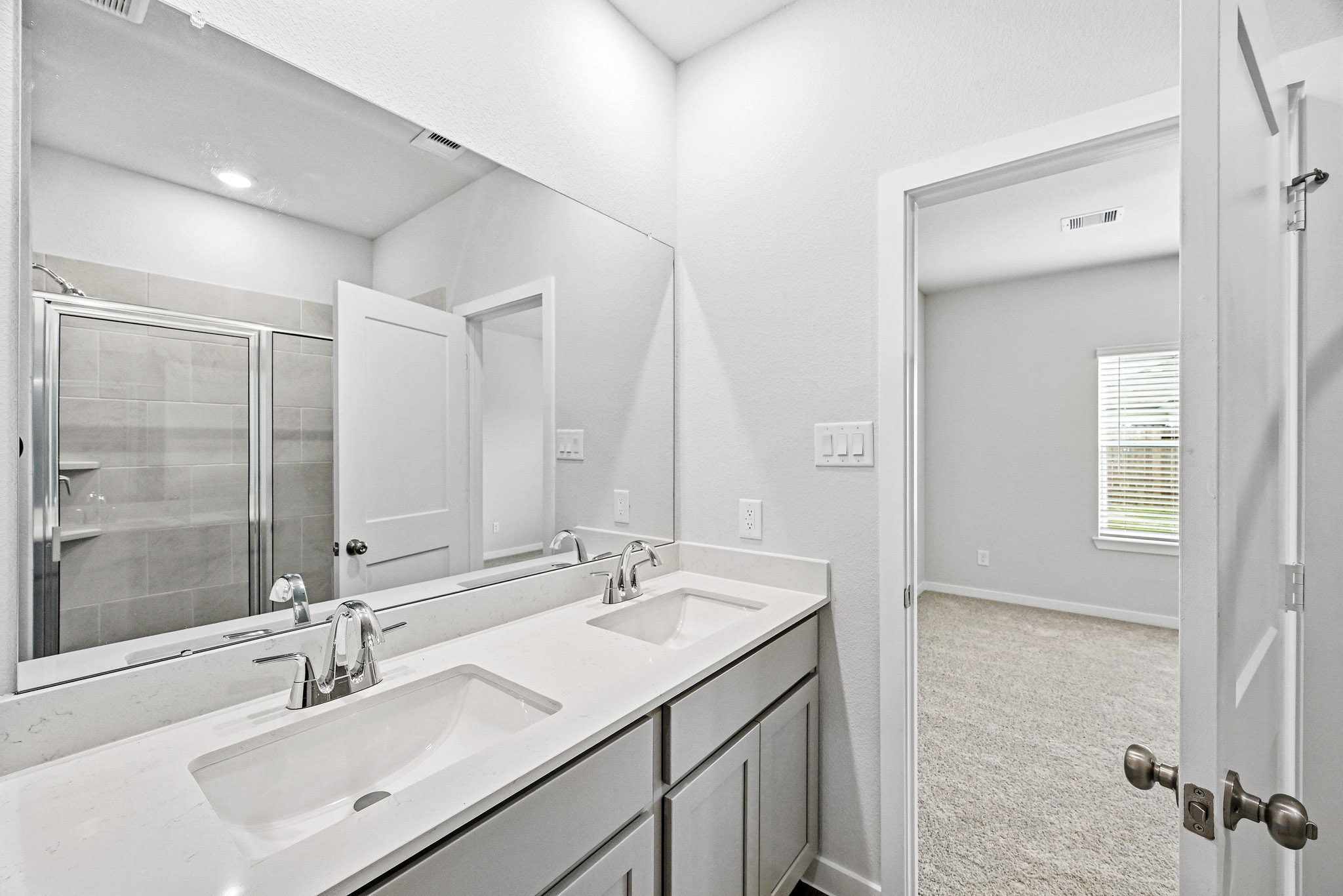 A bathroom with two sinks.