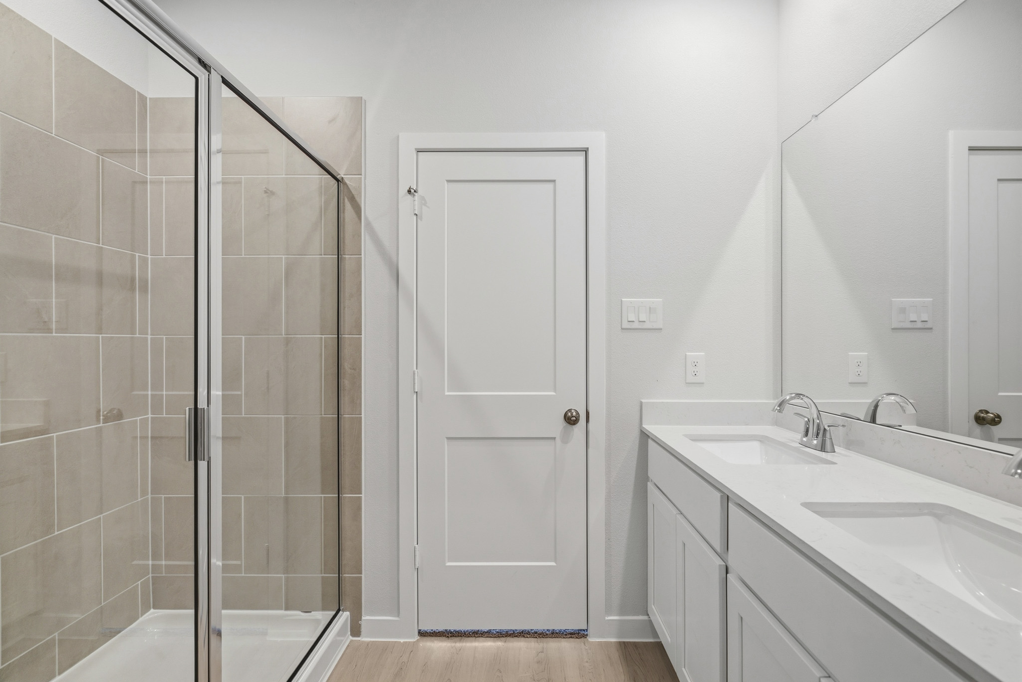 A bathroom with a glass shower.