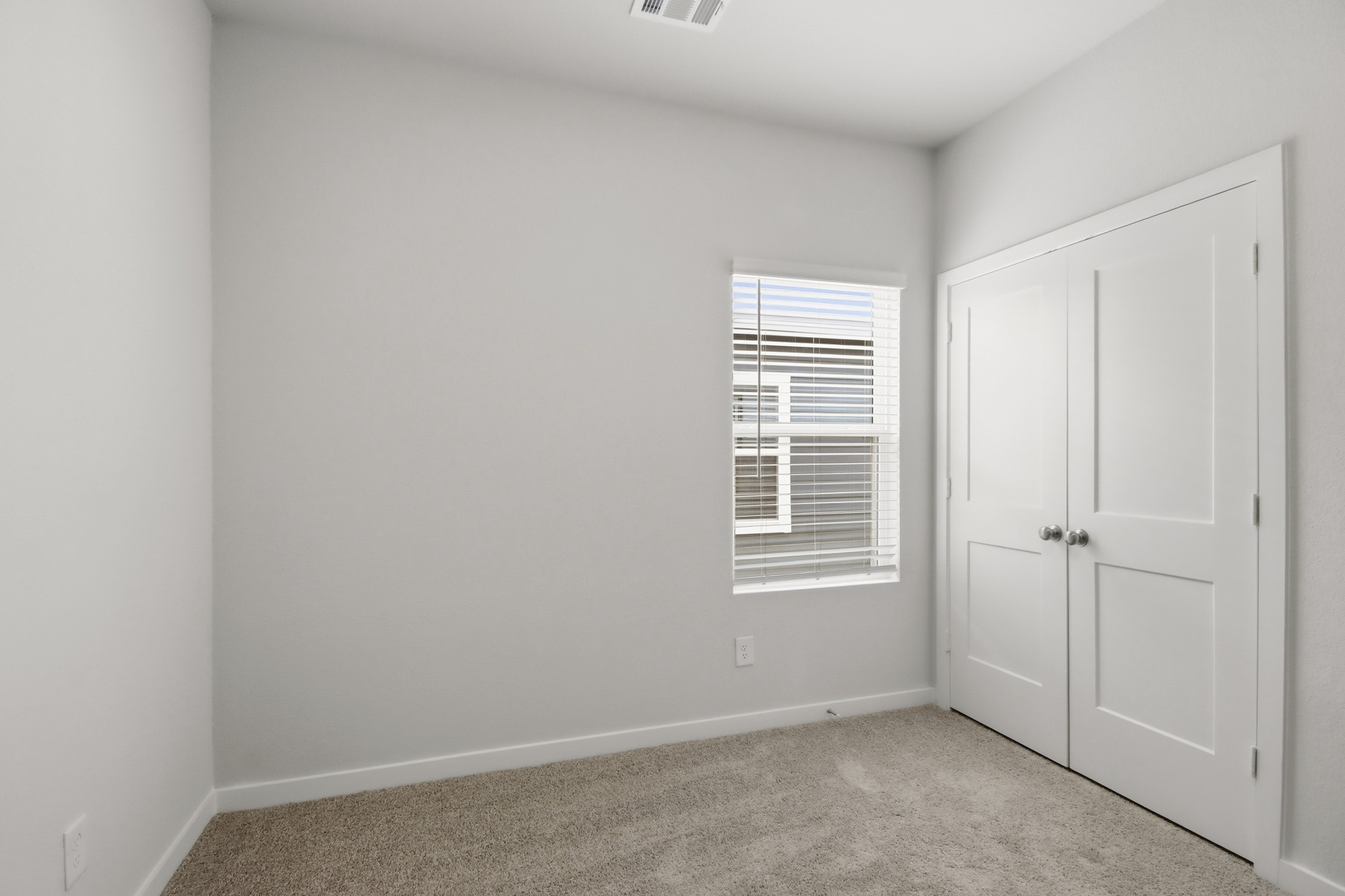 A room with white doors.