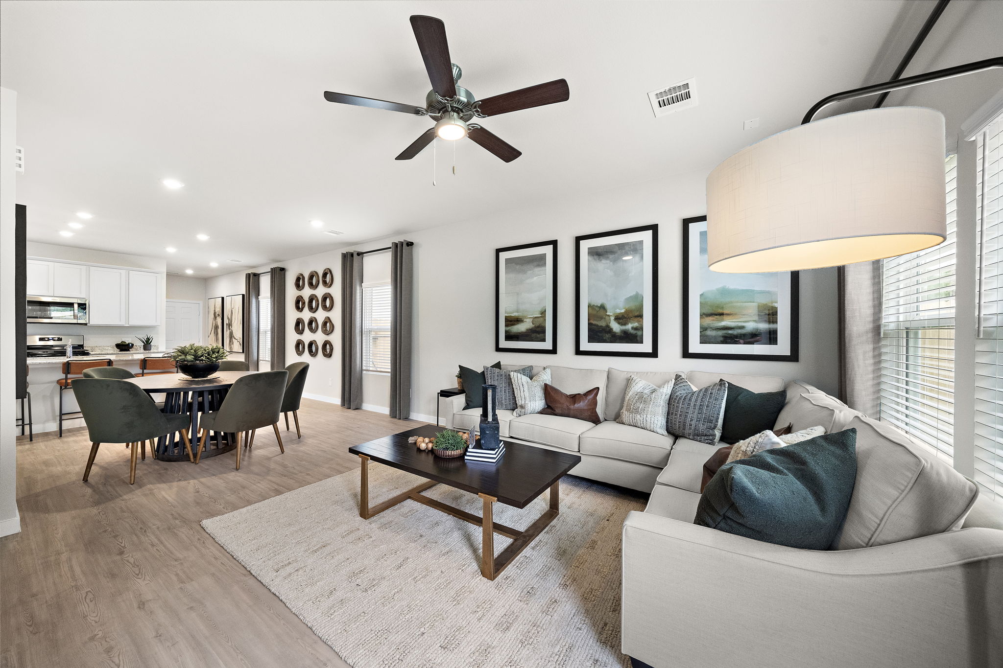 A living room with a ceiling fan.