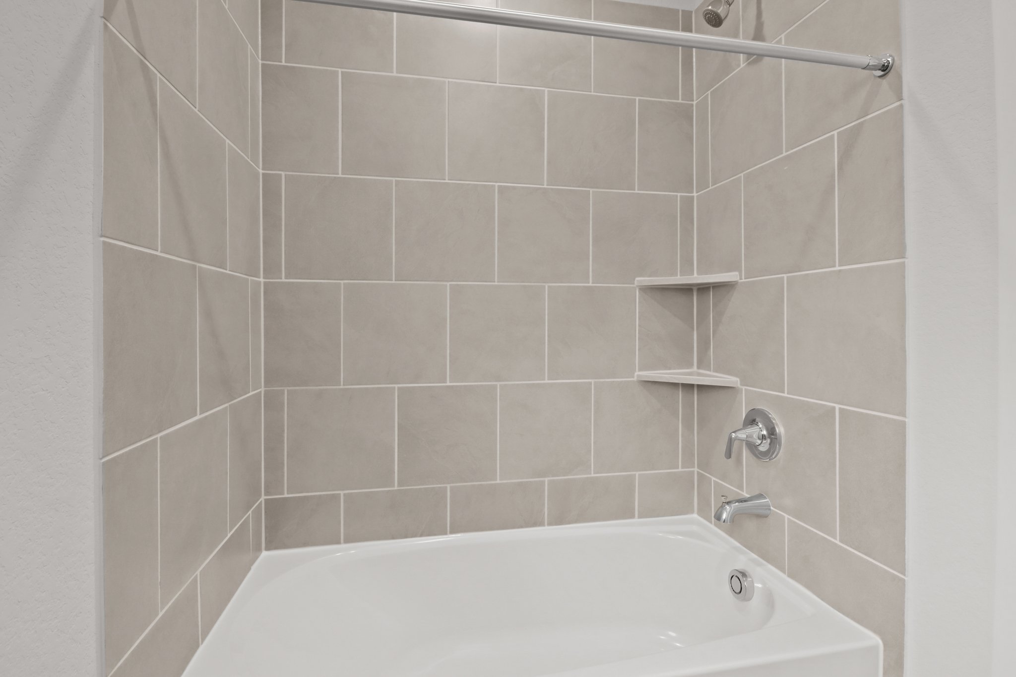 A bathtub in a bathroom.