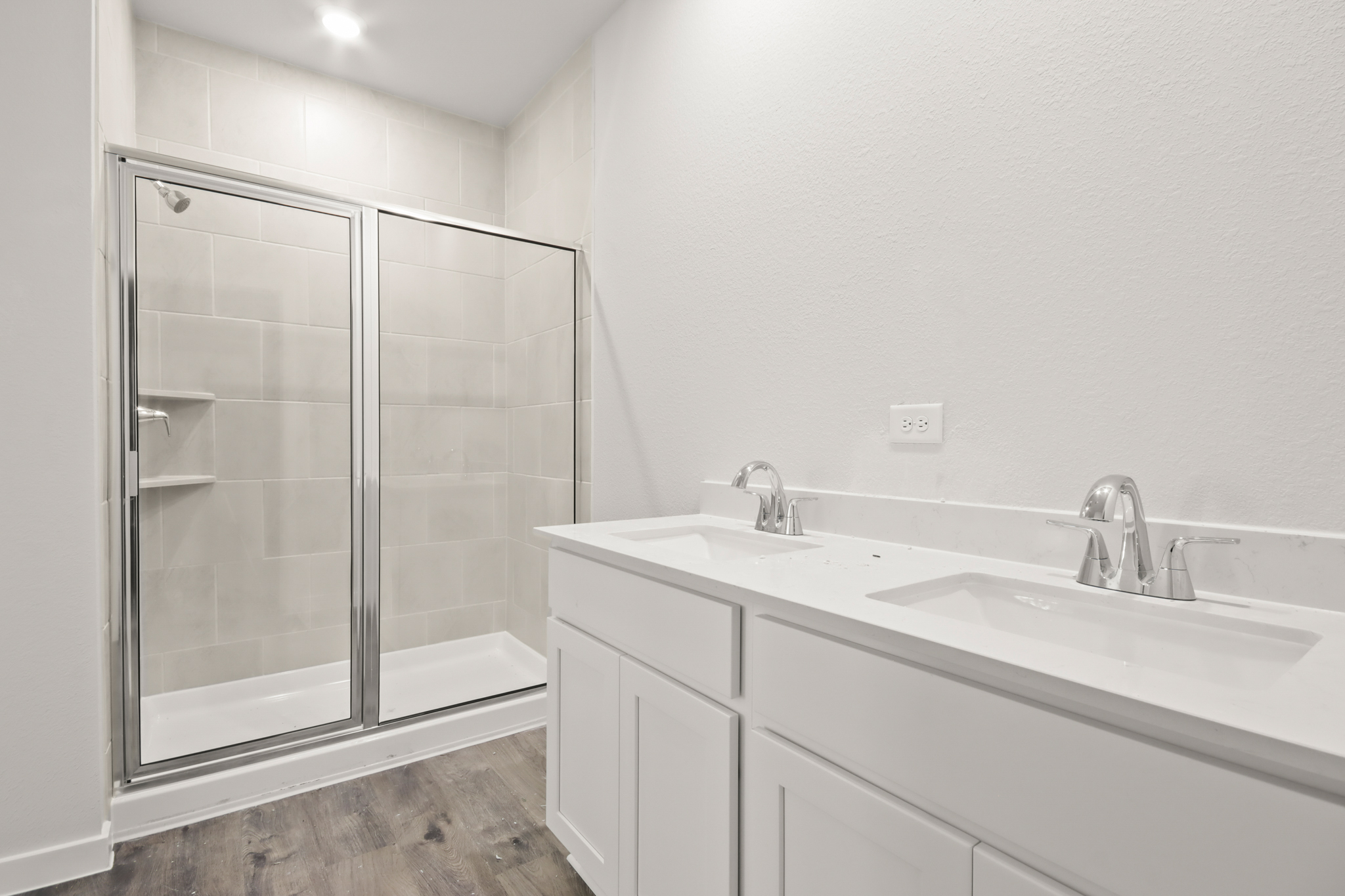 A bathroom with a glass shower.