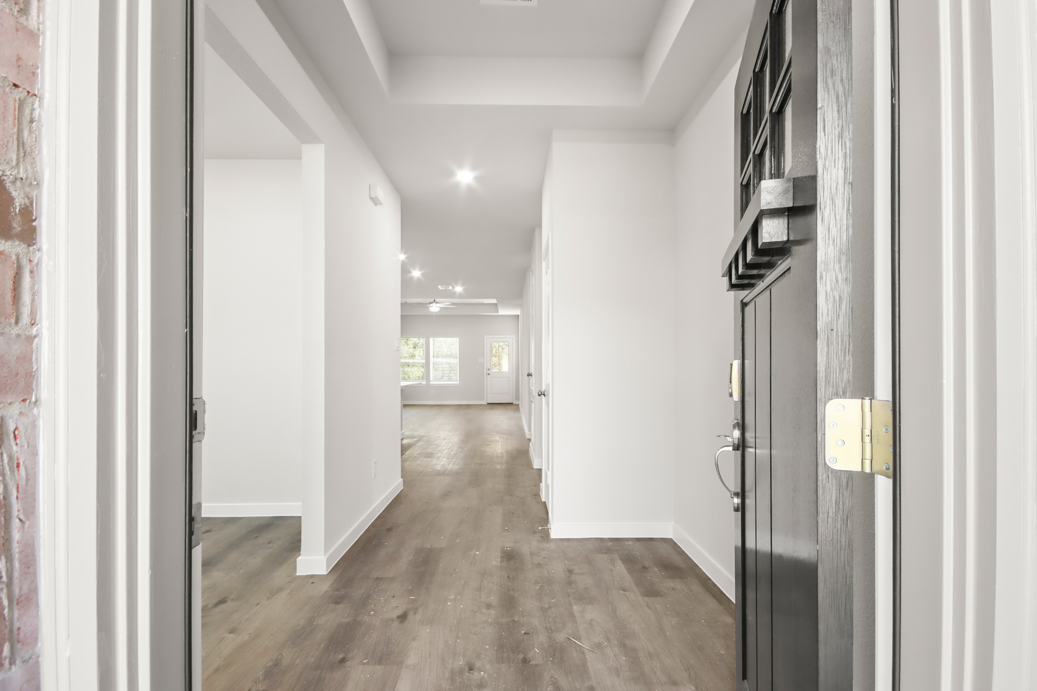 A hallway with white walls.