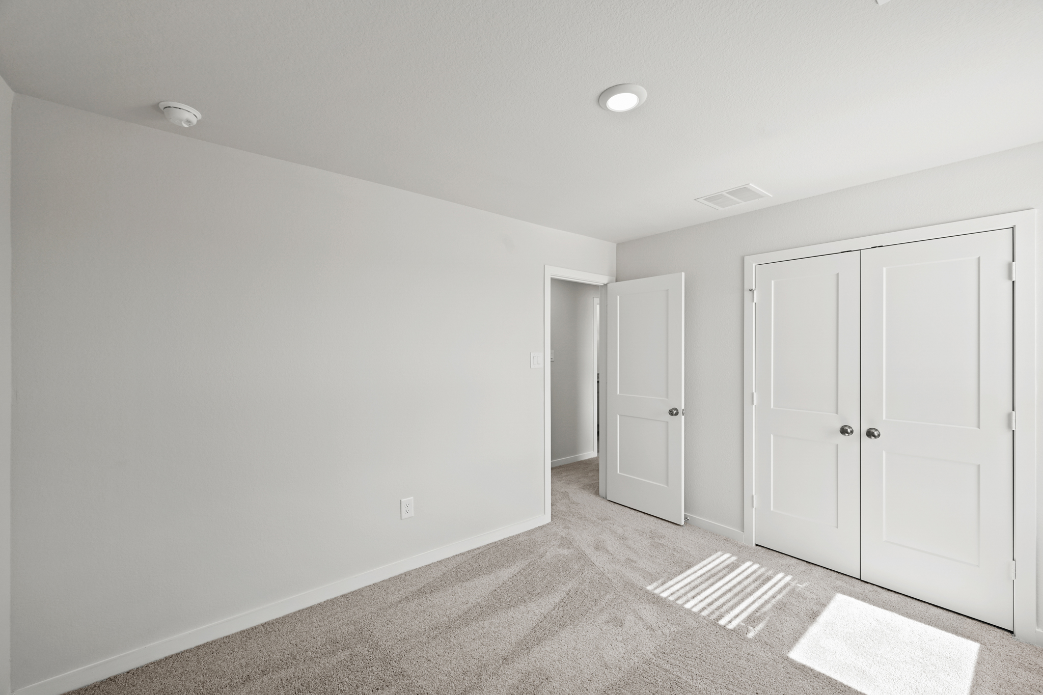 A room with white doors.