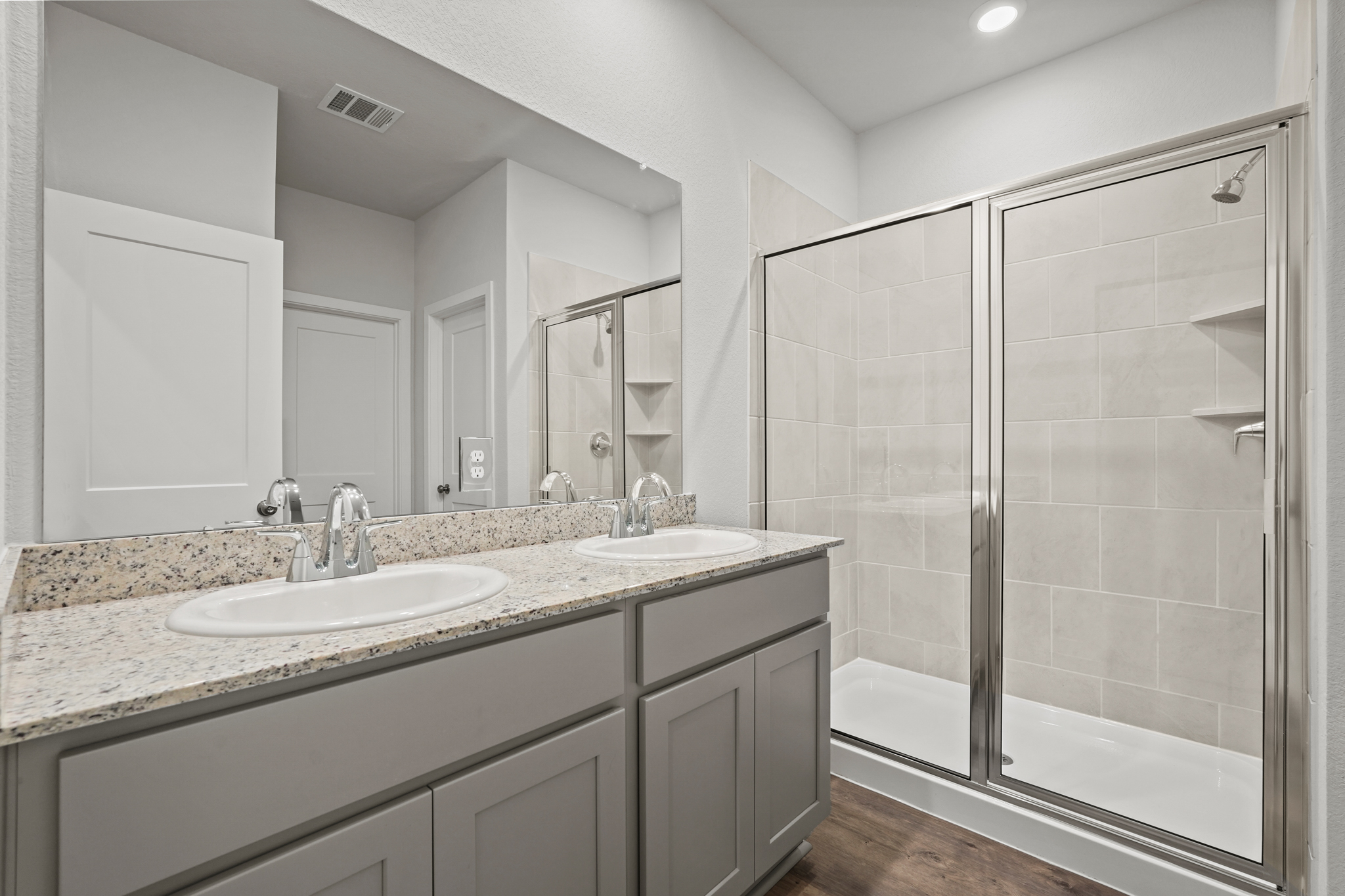 A bathroom with a glass shower.