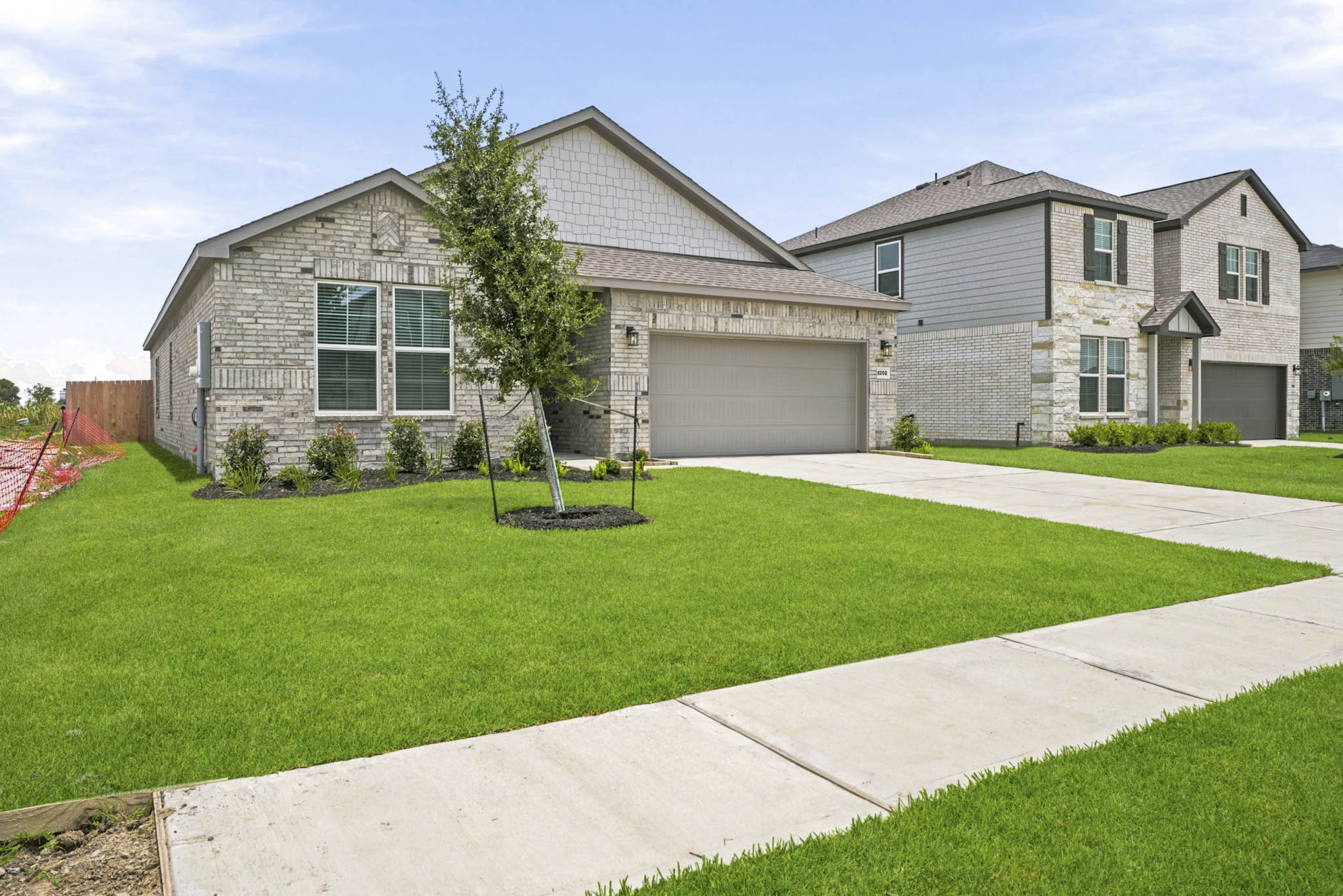 A house with a large front yard.