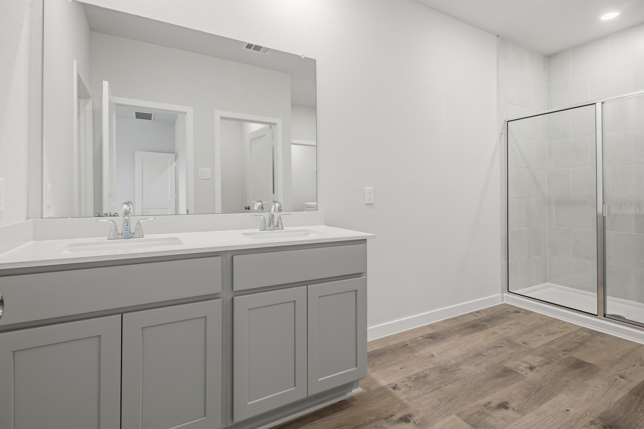 A bathroom with a glass shower.