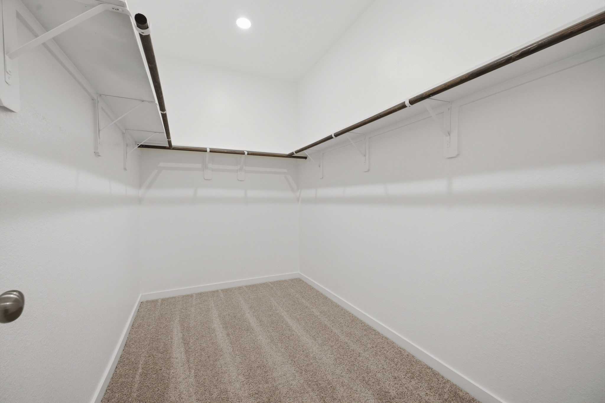 A white room with a staircase.
