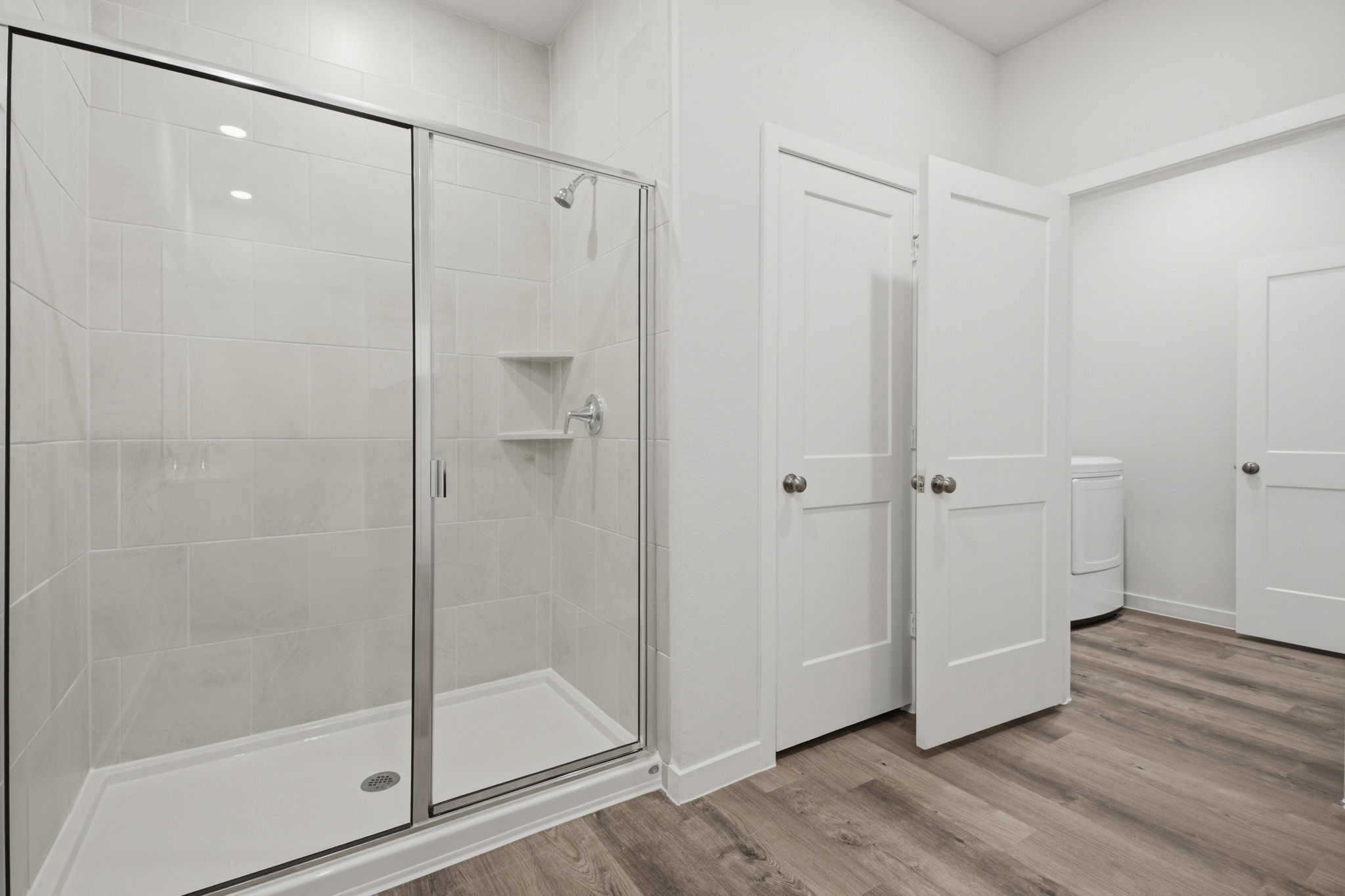 A bathroom with a glass shower.