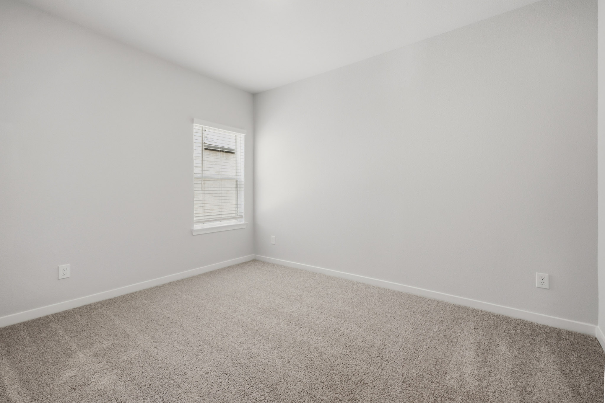 A white wall with a door.
