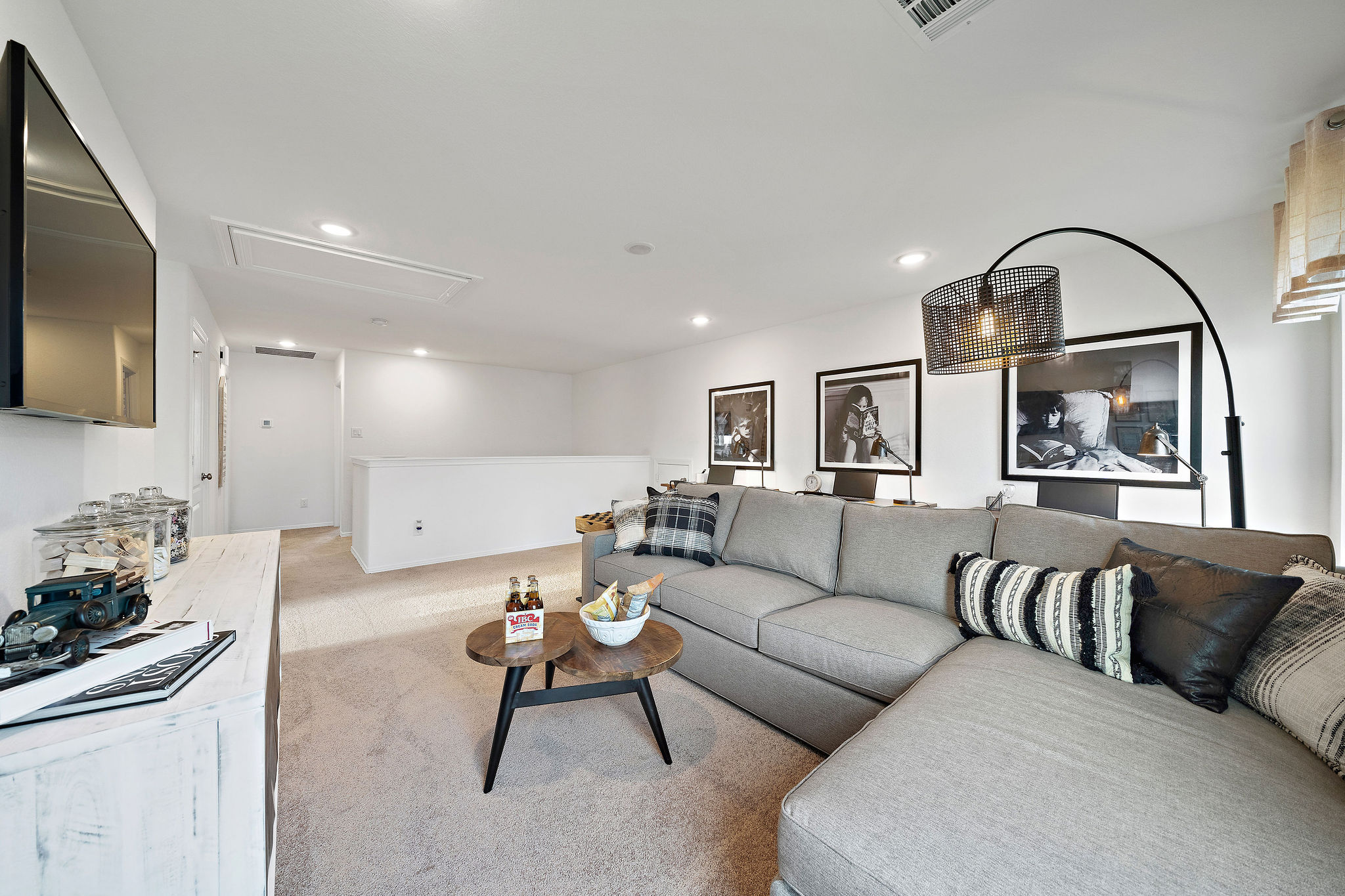 A living room with a couch and a table.
