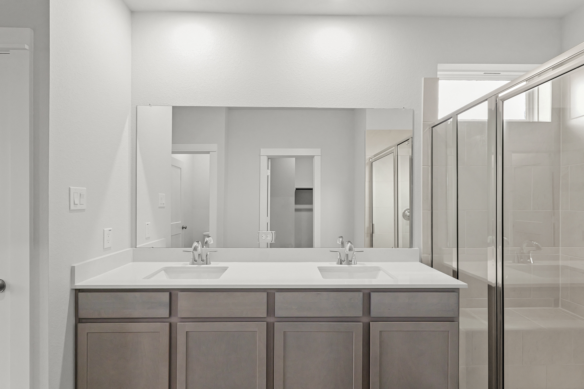 A bathroom with a glass shower.