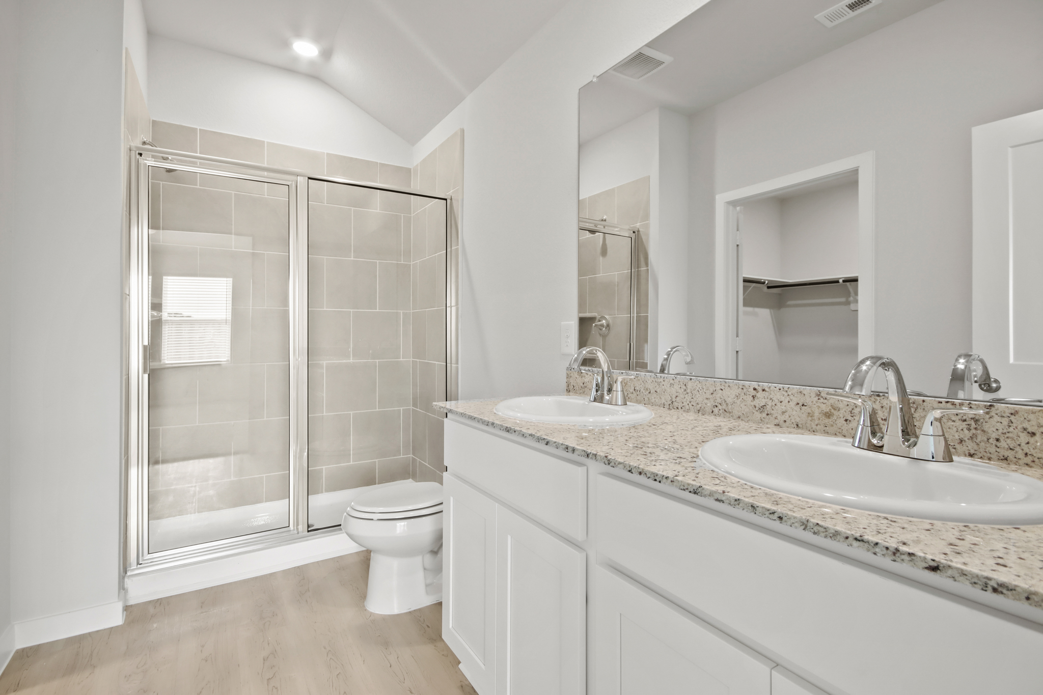 A bathroom with a glass shower.