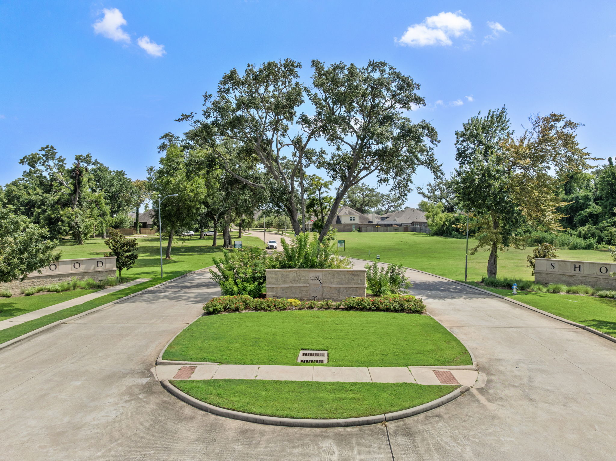 A park with a path and trees.