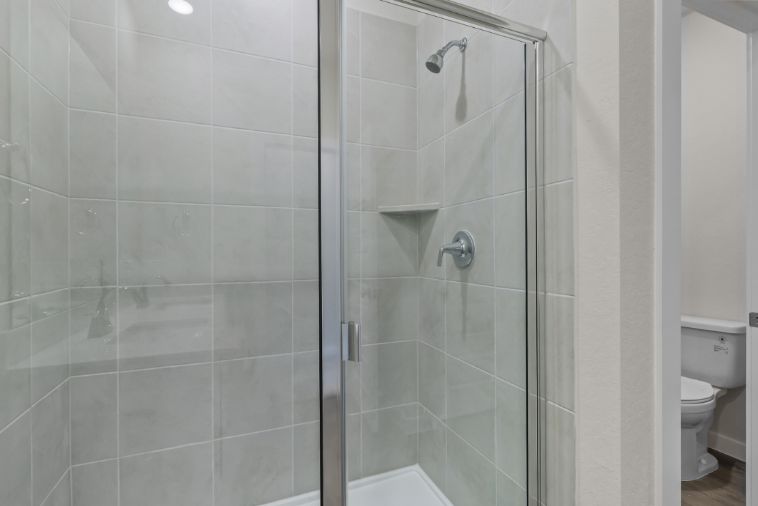 A shower unit in a bathroom.
