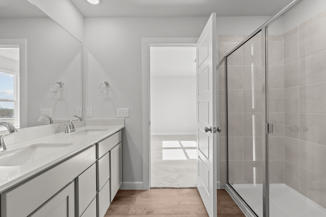 A bathroom with a glass shower.