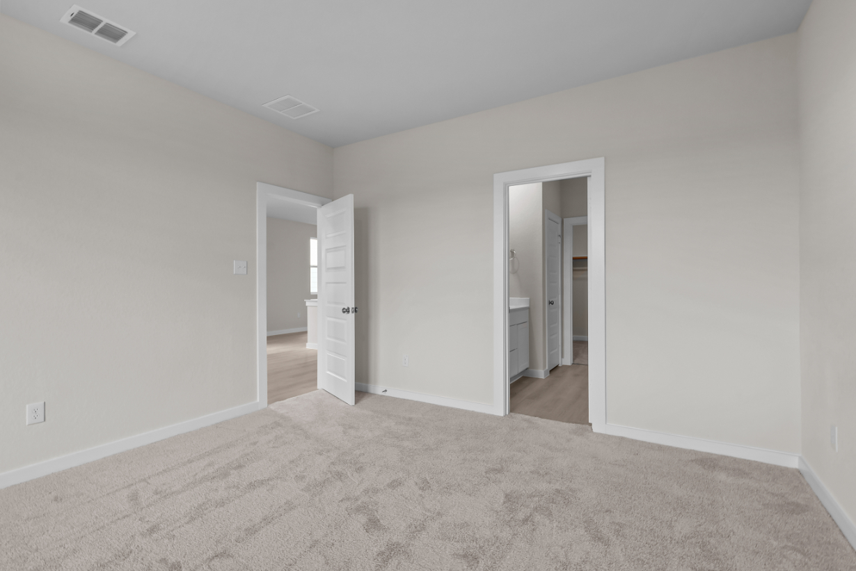 A hallway with white walls.