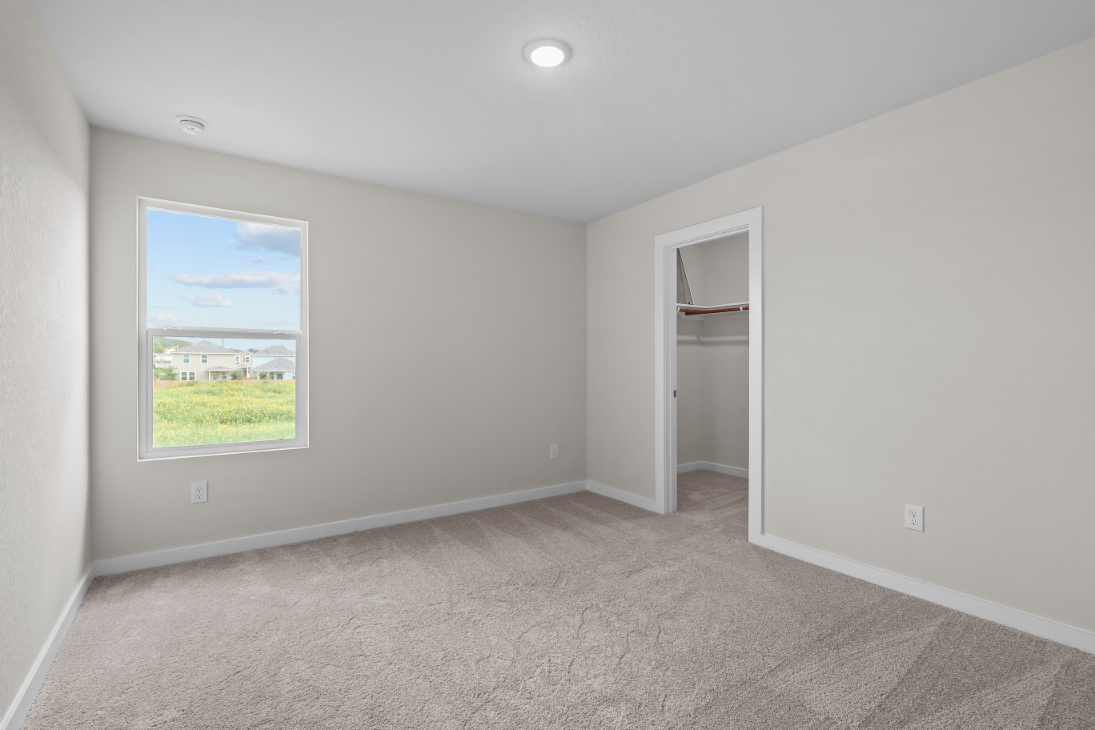 A room with a window and a door.