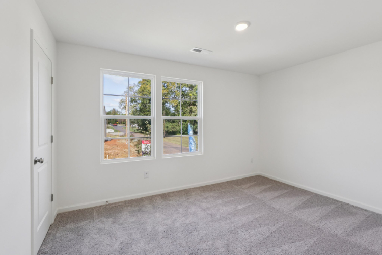 A room with a window and a door.