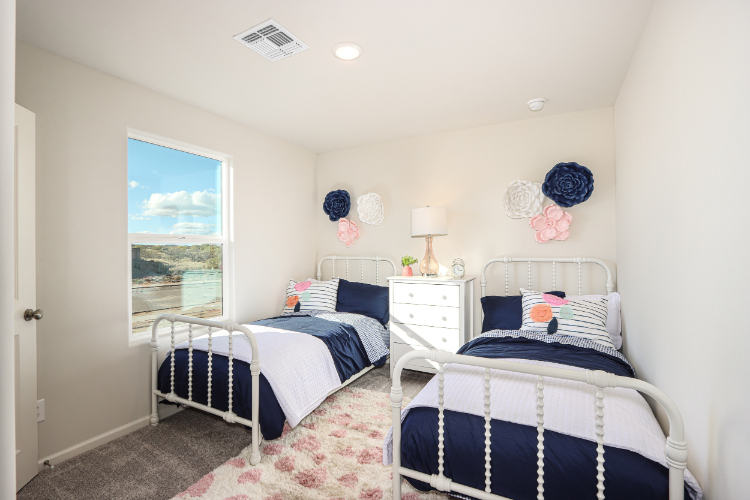 A bedroom with two beds.