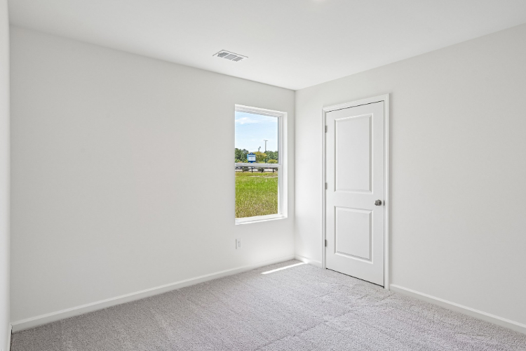 A room with a door and a window.