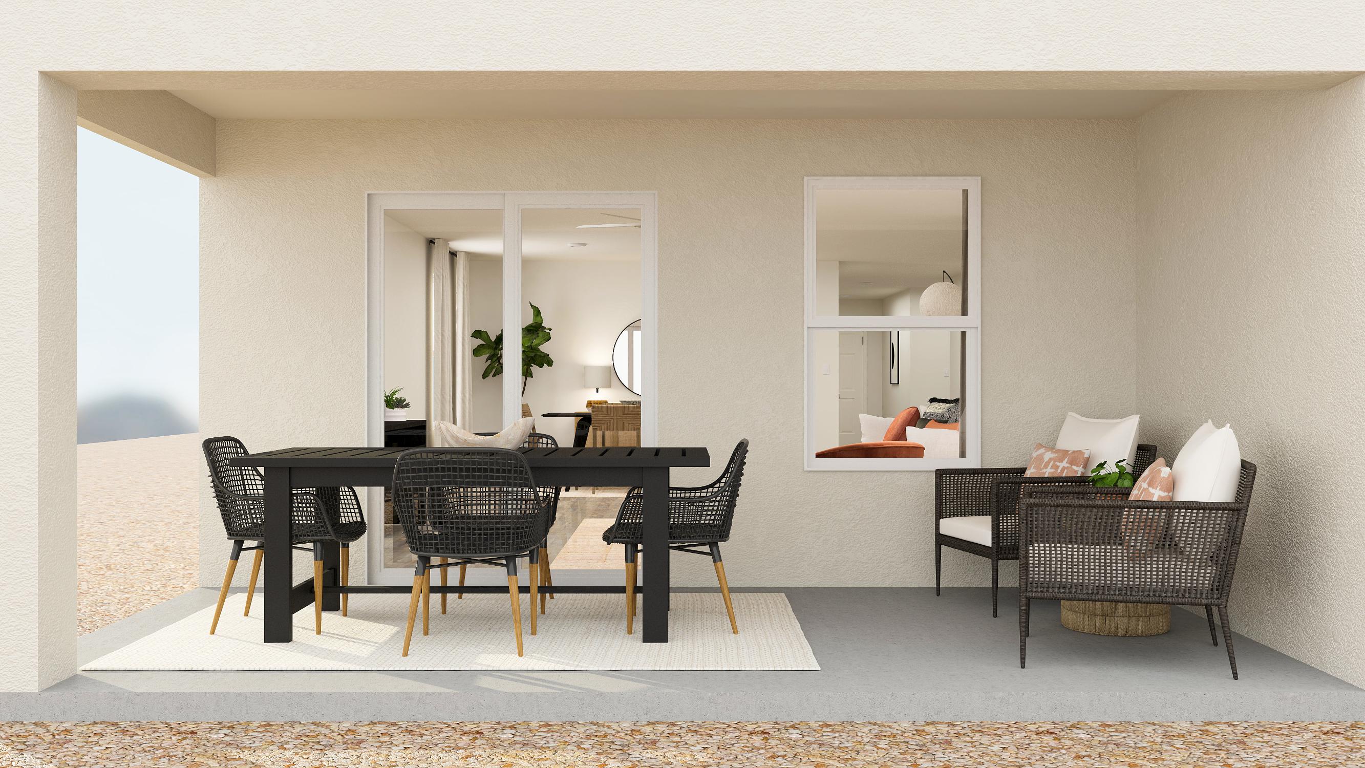 A dining room with a table and chairs.