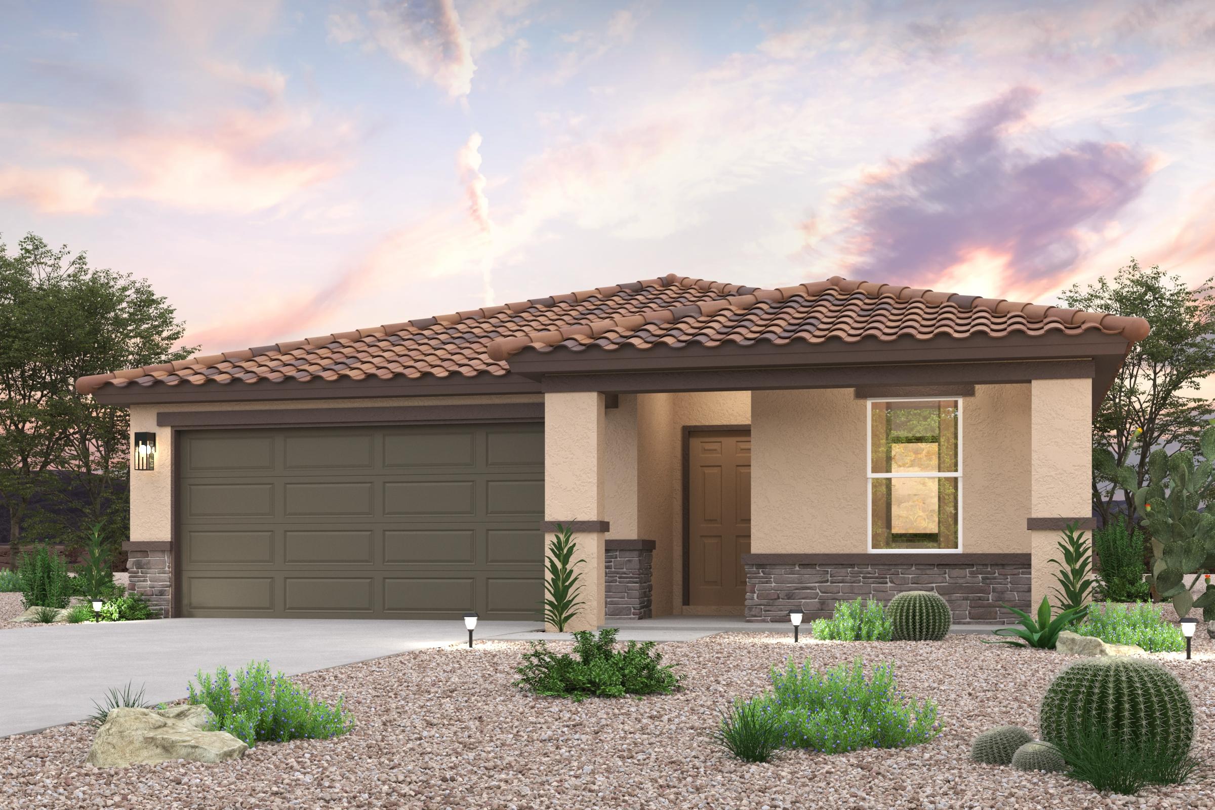 A house with a garage and bushes in front of it.