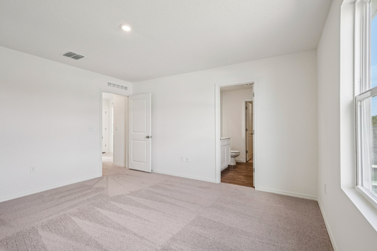 A hallway with white walls.
