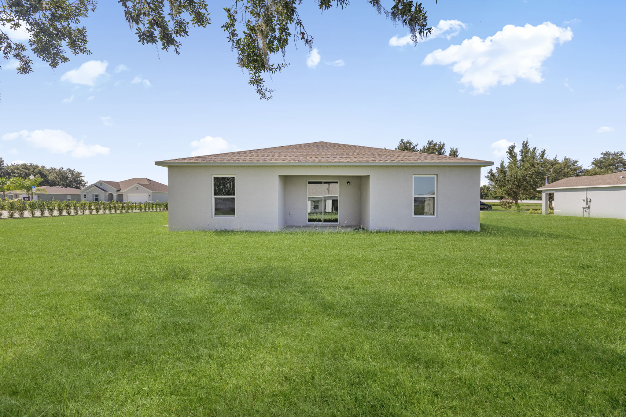A house in a grassy field.