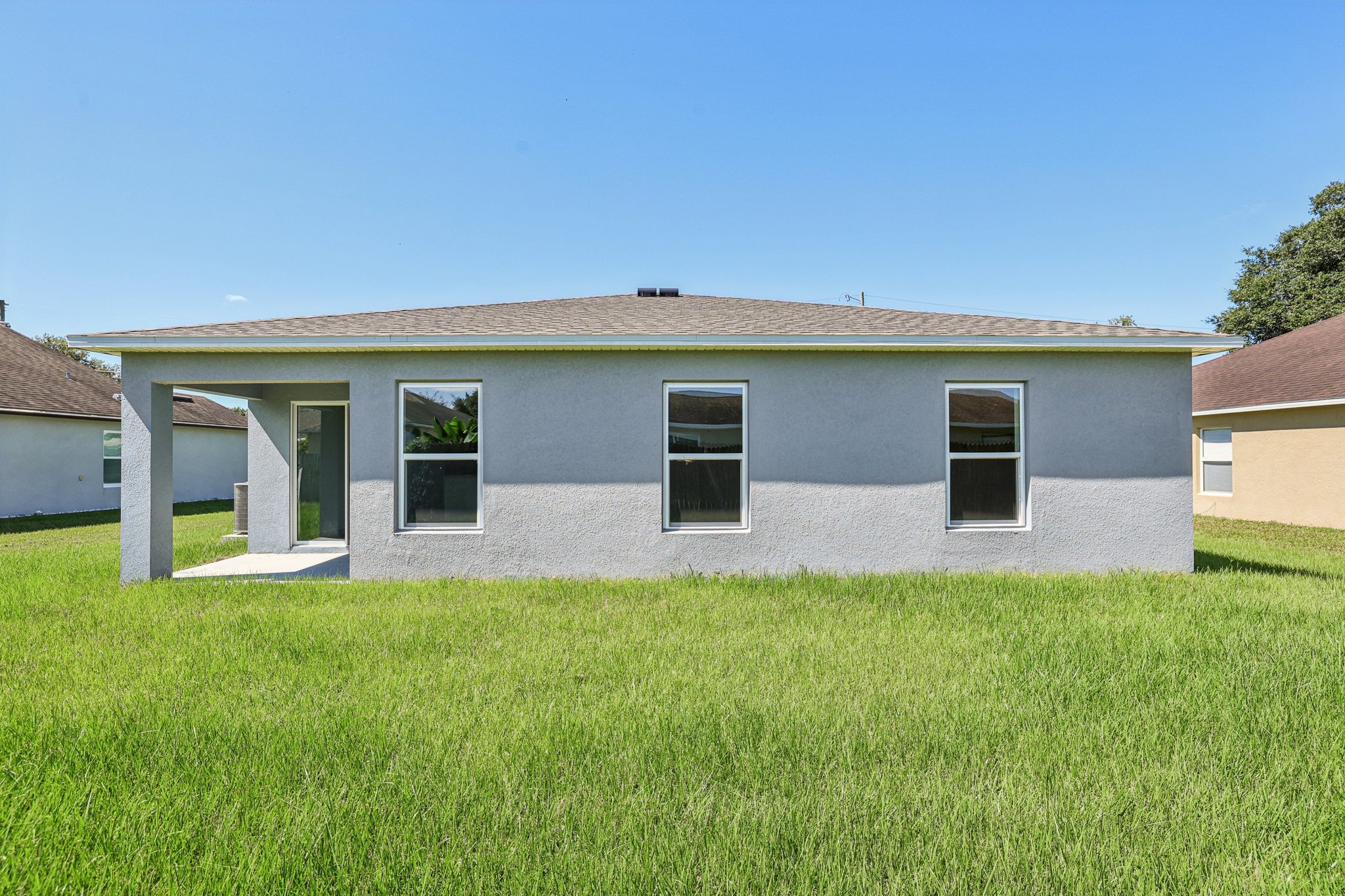 A house with a grass yard.