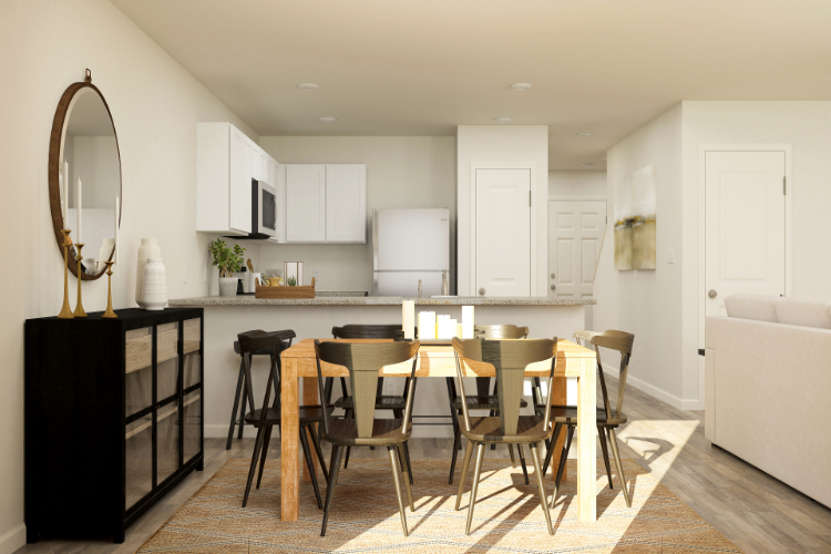 A kitchen with a dining table.