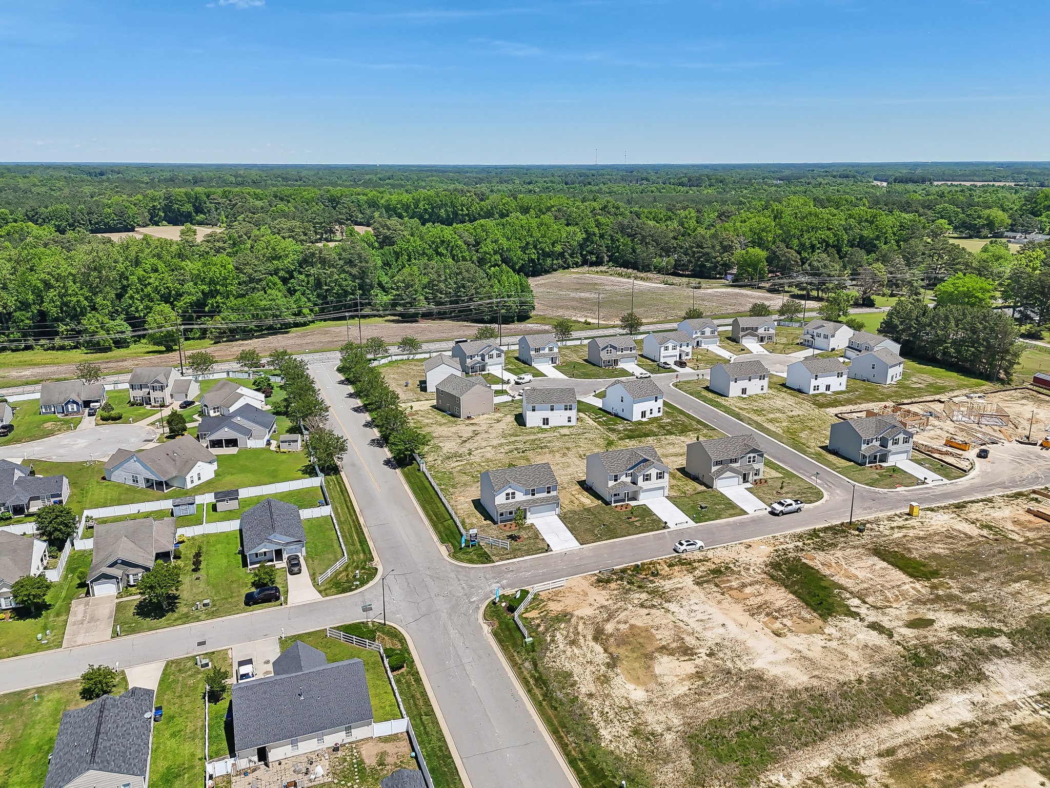 A group of houses in a field.