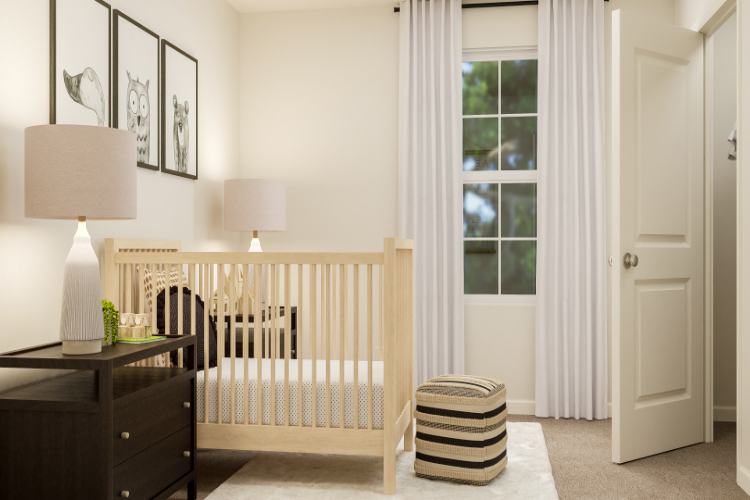 A white room with a white crib and a white curtain.