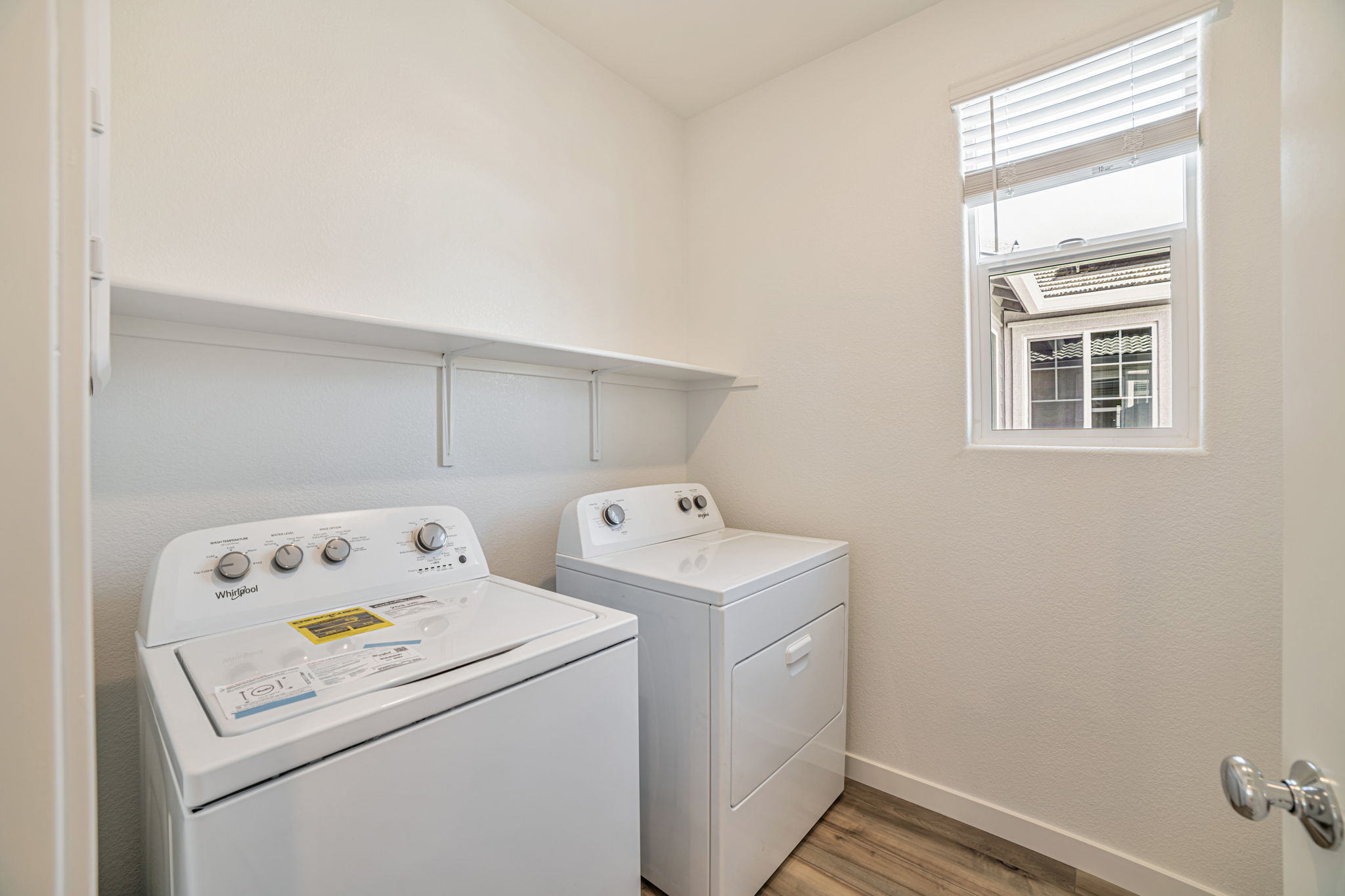 A laundry room with a washer and dryer.