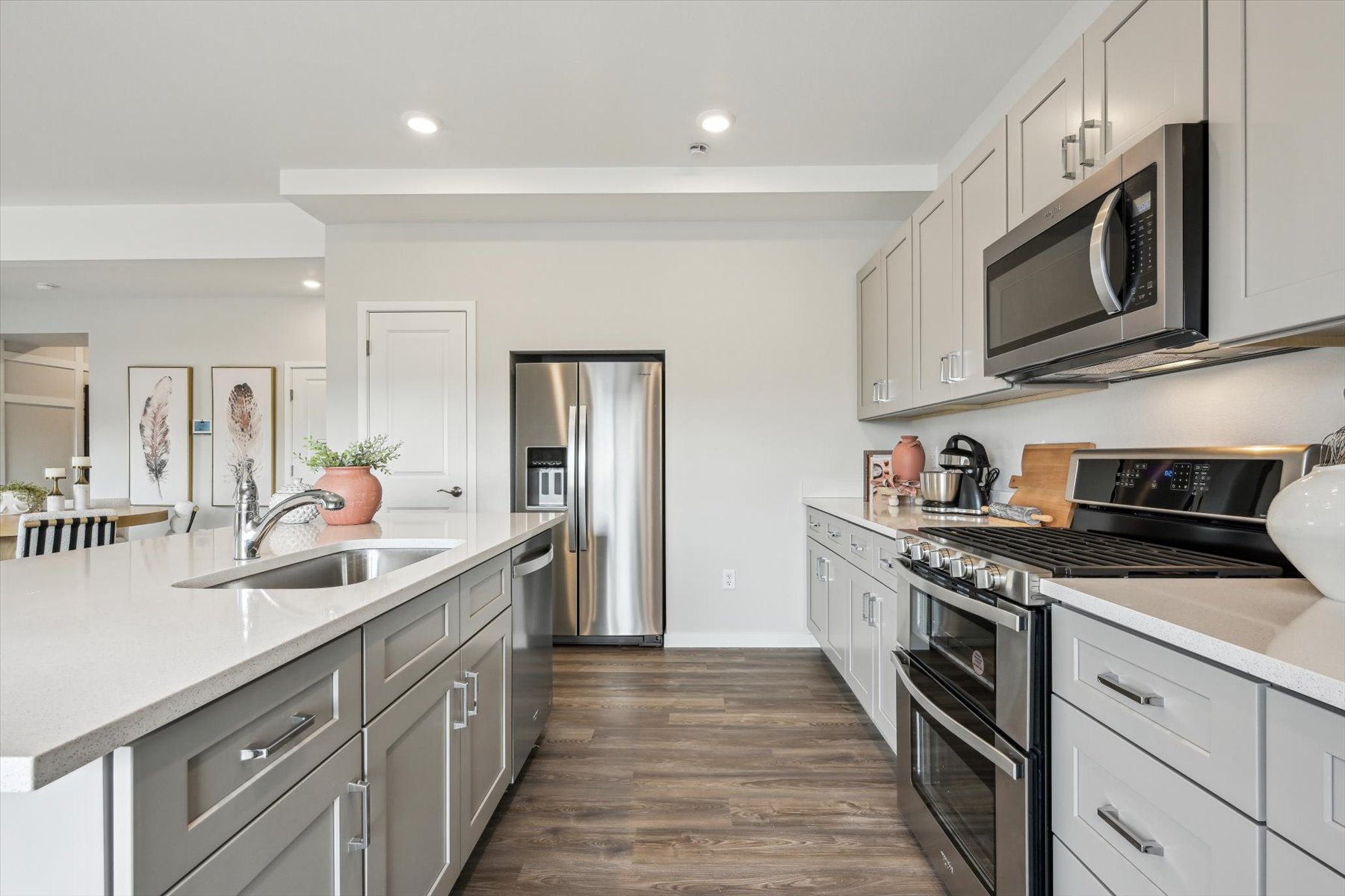 A kitchen with white cabinets.